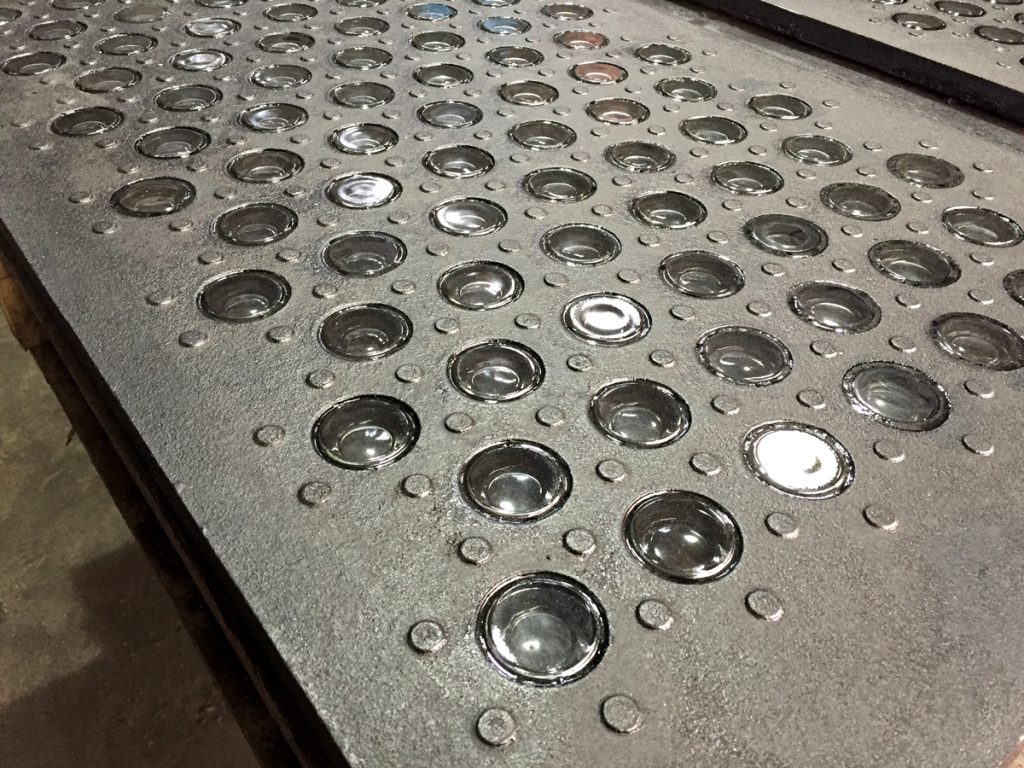 Lighted subway vault glass cast iron panel.